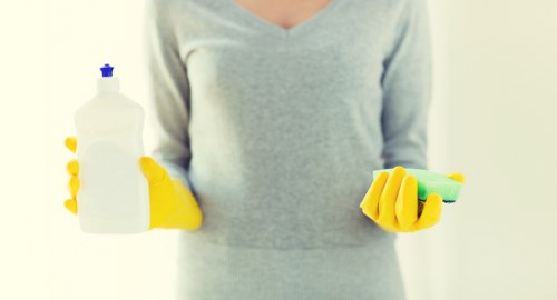 Domestic cleaner working in a Kingston home living room