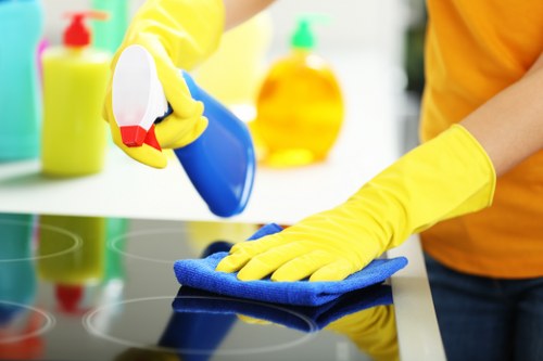 Cleaning staff working around office access and parking in Kingston