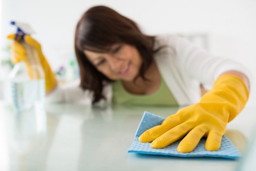 Deep cleaning team following health and safety standards in a property