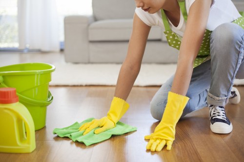 Local Kingston cleaner working in a residential hallway and staircase